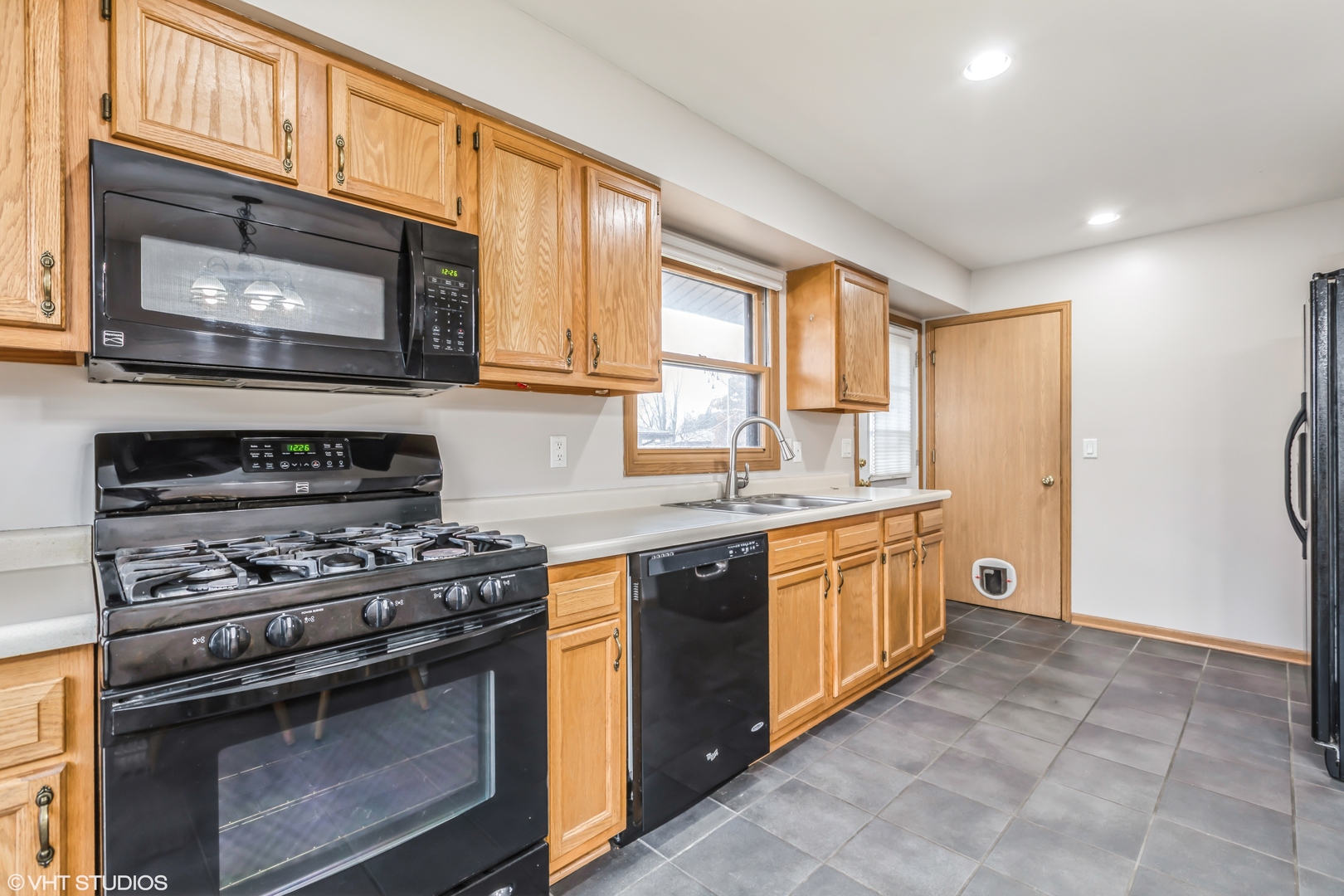 5 Hunters Path Lake In The Hills, IL 60156 - Photo 6 of 20 a kitchen with stainless steel appliances granite countertop a stove a sink and a microwave