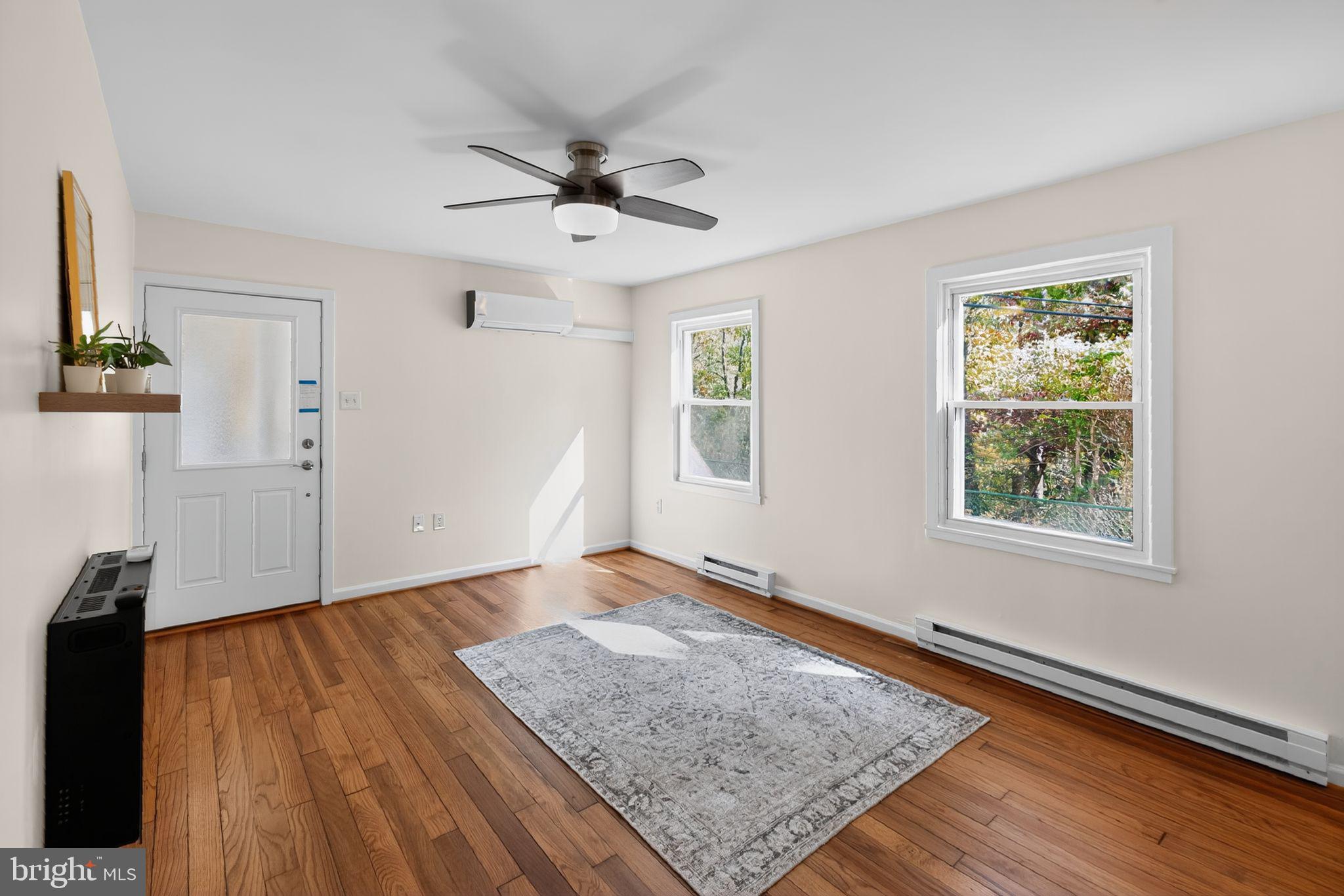 20 Hillside Road Greenbelt, MD 20770 - Photo 12 of 22 wooden floor in an empty room with a window