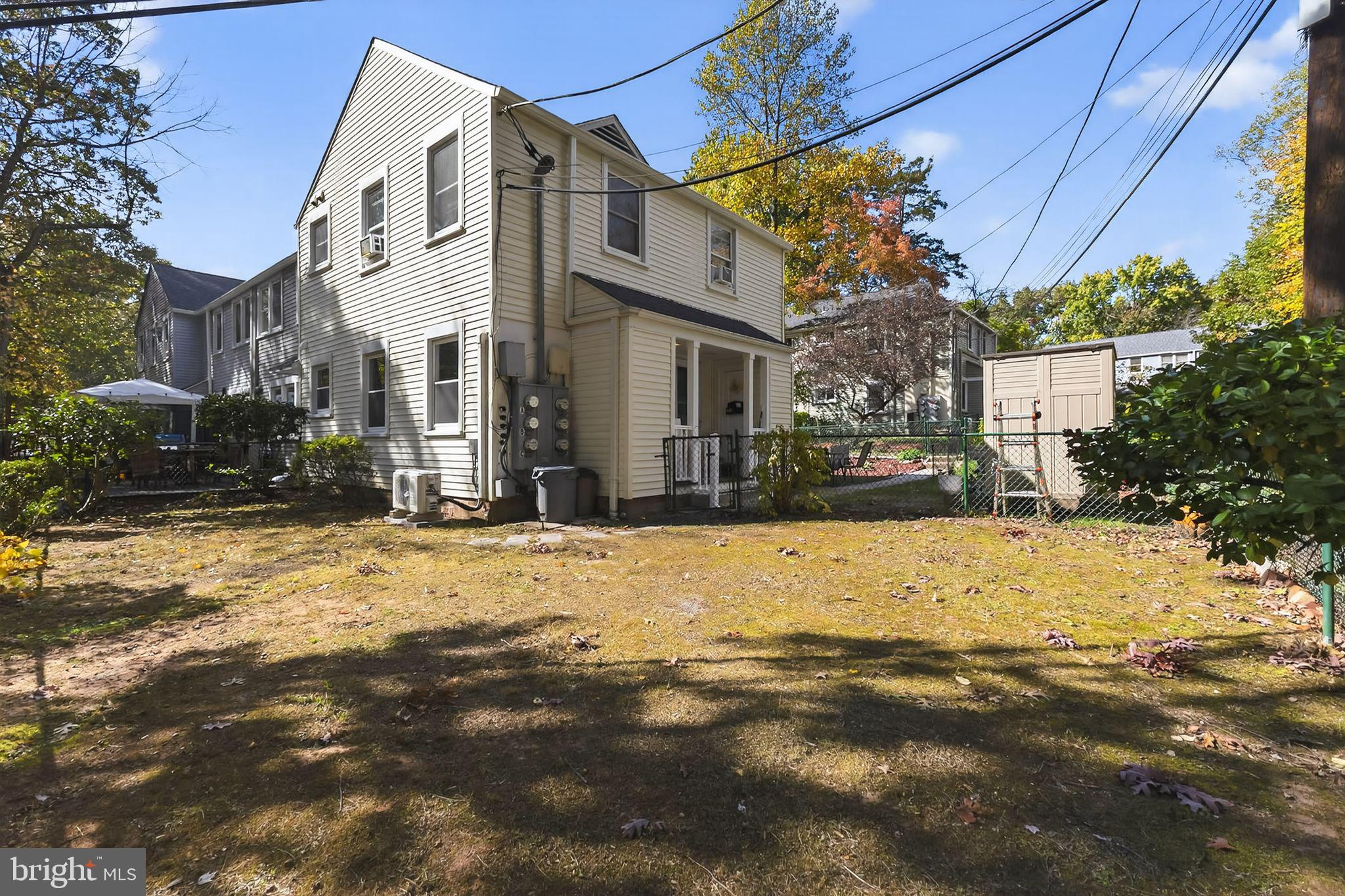 20 Hillside Road Greenbelt, MD 20770 - Photo 3 of 22 a view of a white house with a snow on the road
