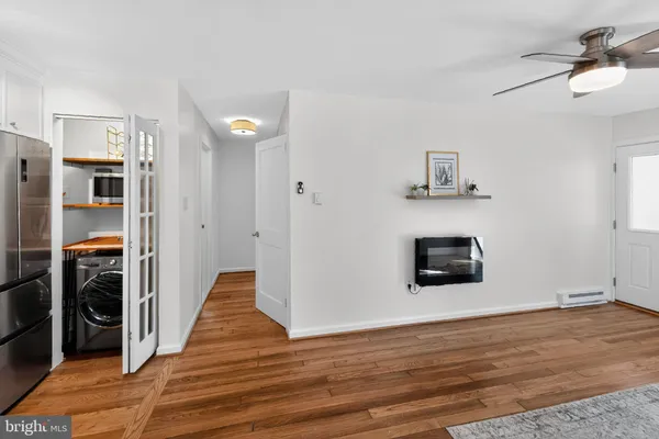 a view of a livingroom with wooden floor