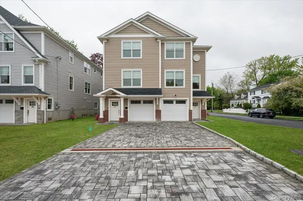 a view of house with a yard