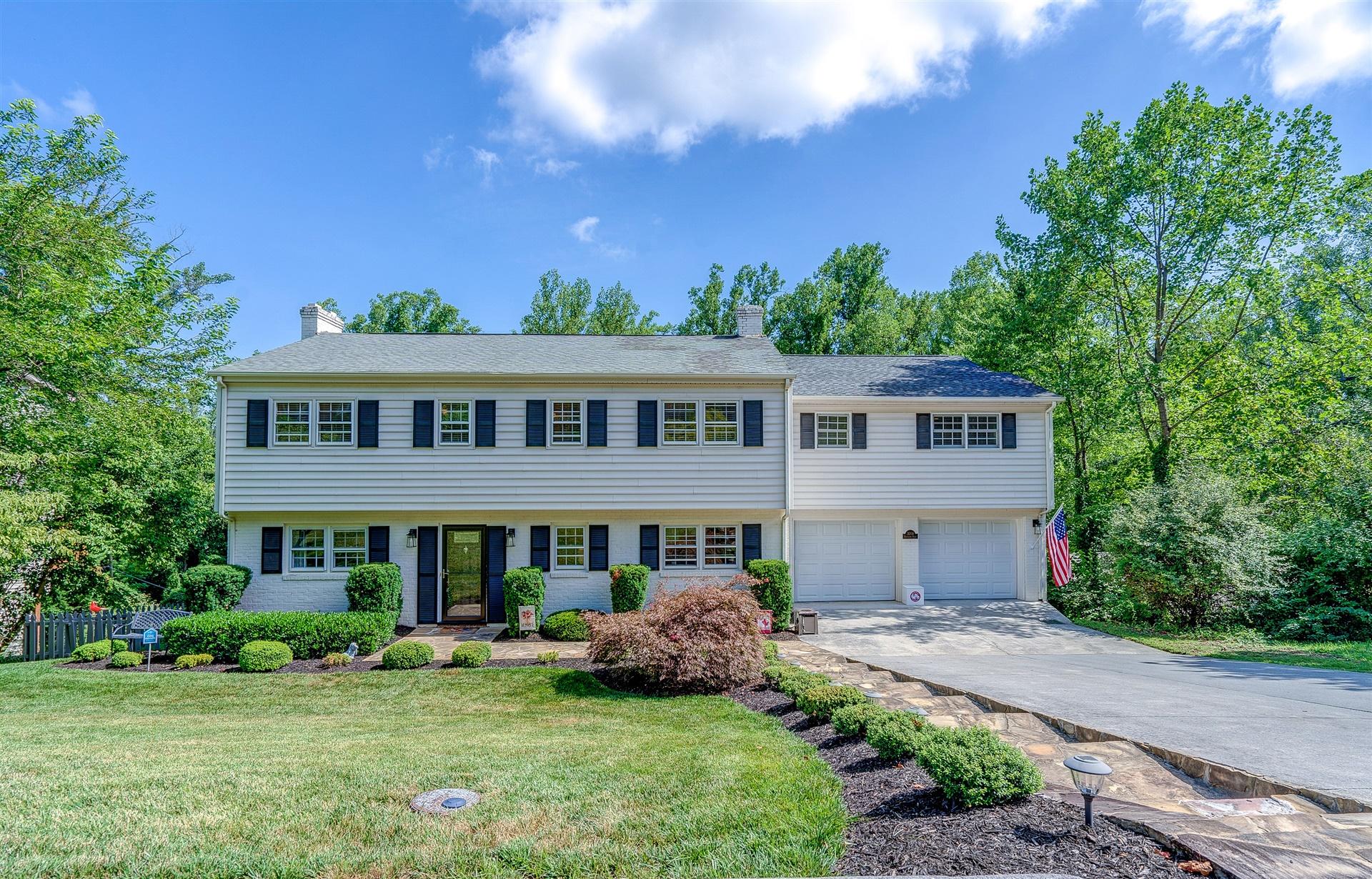 3009 Burnleigh Road Southwest Roanoke, VA 24014 - Photo 1 of 59 a front view of a house with a garden