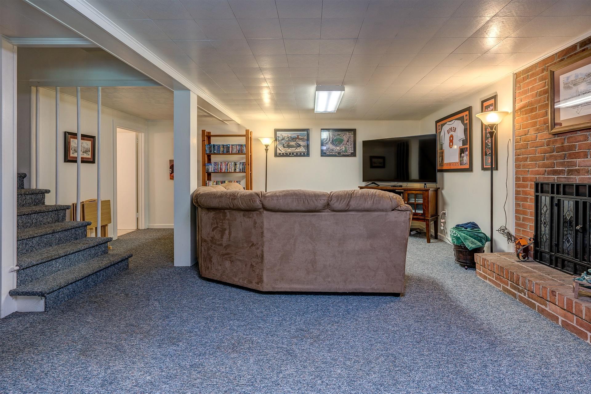 3009 Burnleigh Road Southwest Roanoke, VA 24014 - Photo 53 of 59 a living room with furniture and a flat screen tv