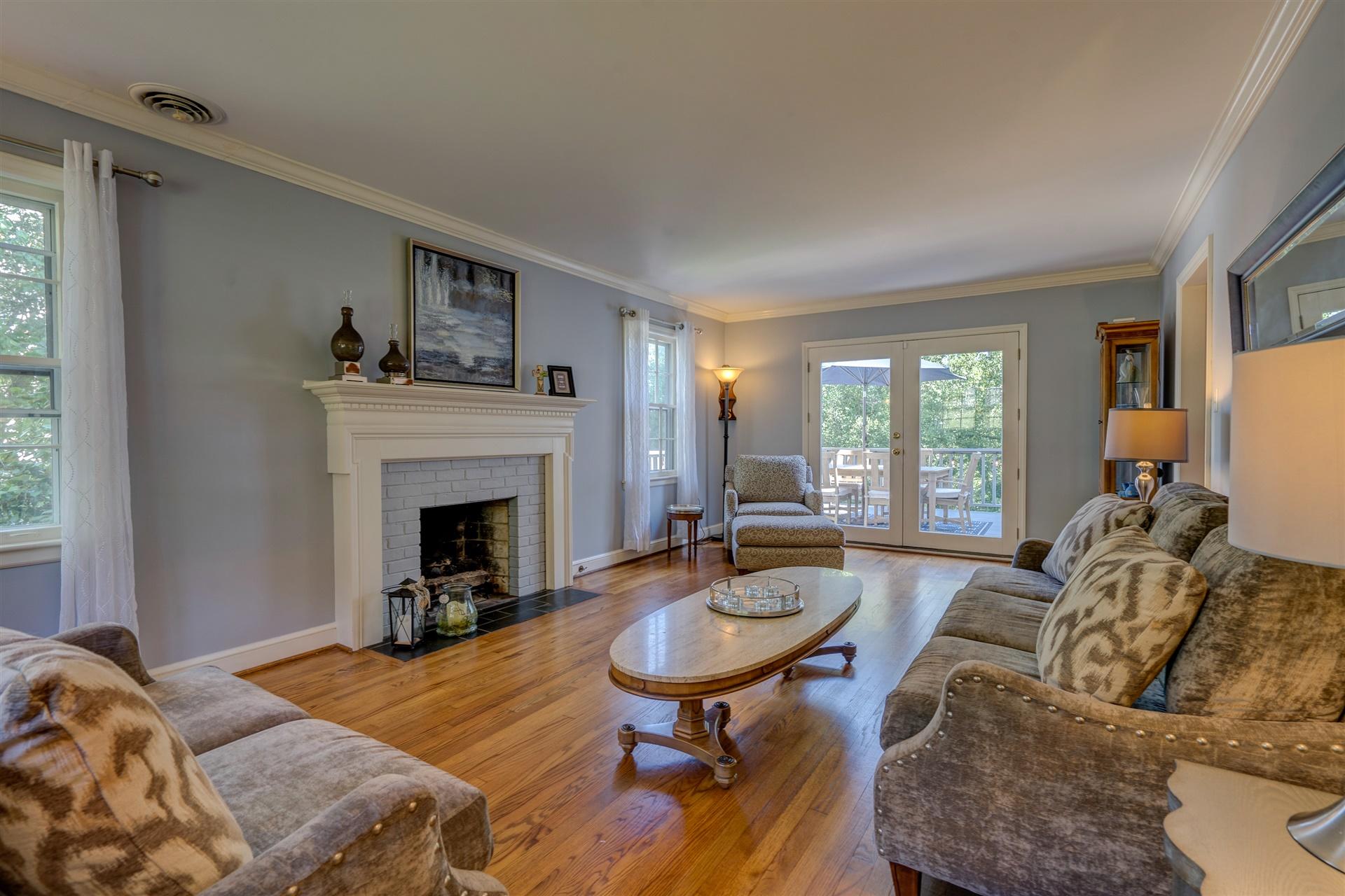 3009 Burnleigh Road Southwest Roanoke, VA 24014 - Photo 7 of 59 a living room with furniture a fireplace and a table