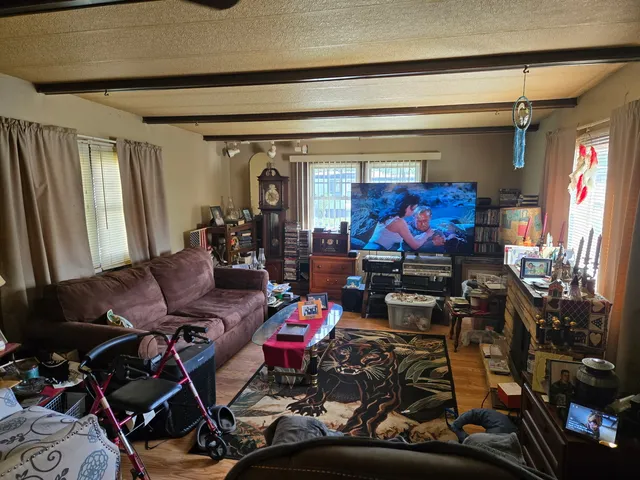 a living room with furniture and a large window