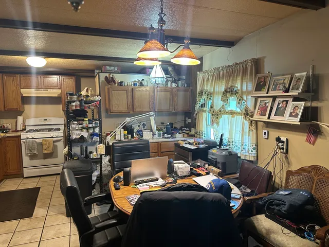 a kitchen with a sink and wooden cabinets