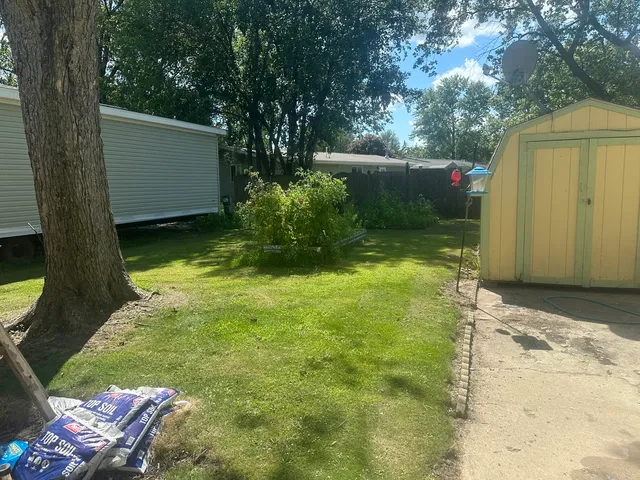 a view of backyard with green space