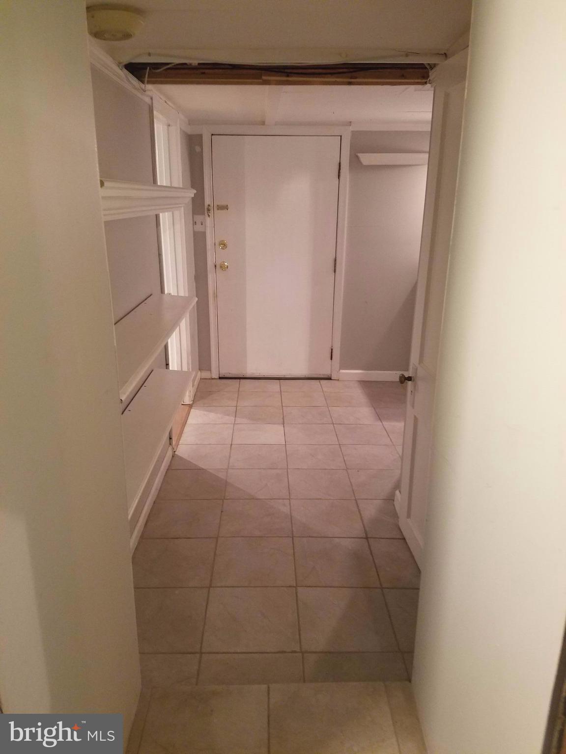 304 Aigburth Road Baltimore, MD 21286 - Photo 23 of 28 Tiled Lower Level Hallway to Bedrm and Laundry Rm