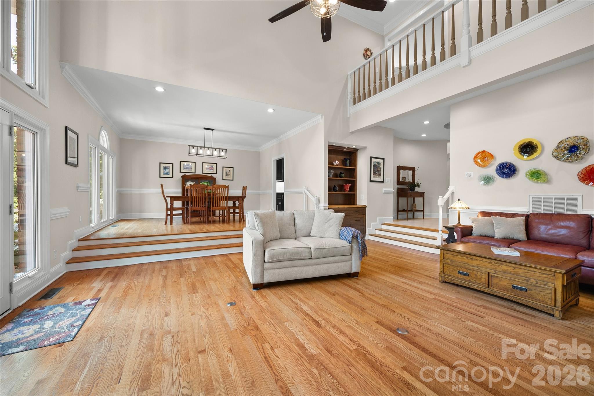 636 Landsdowne Court Fort Mill, SC 29708 - Photo 8 of 48 a living room with furniture and a wooden floor