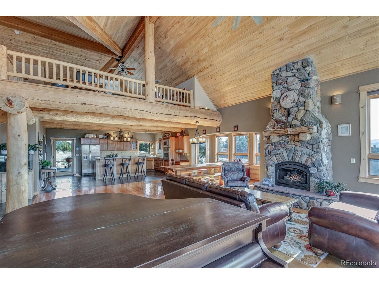 11677 Saddle Ridge Court Salida, CO 81201 - Photo 14 of 45 a living room with furniture and a fireplace
