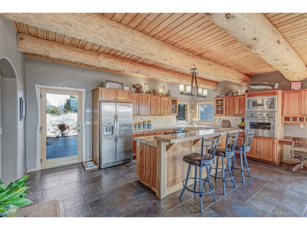 11677 Saddle Ridge Court Salida, CO 81201 - Photo 21 of 45 a view of a dining room with furniture and wooden floor