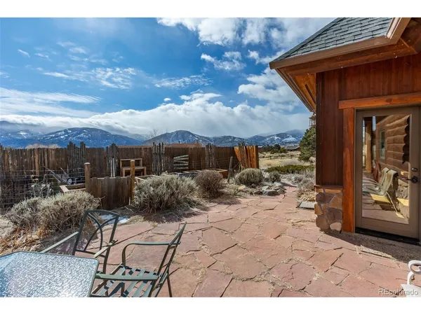 a view of a house with backyard porch and patio