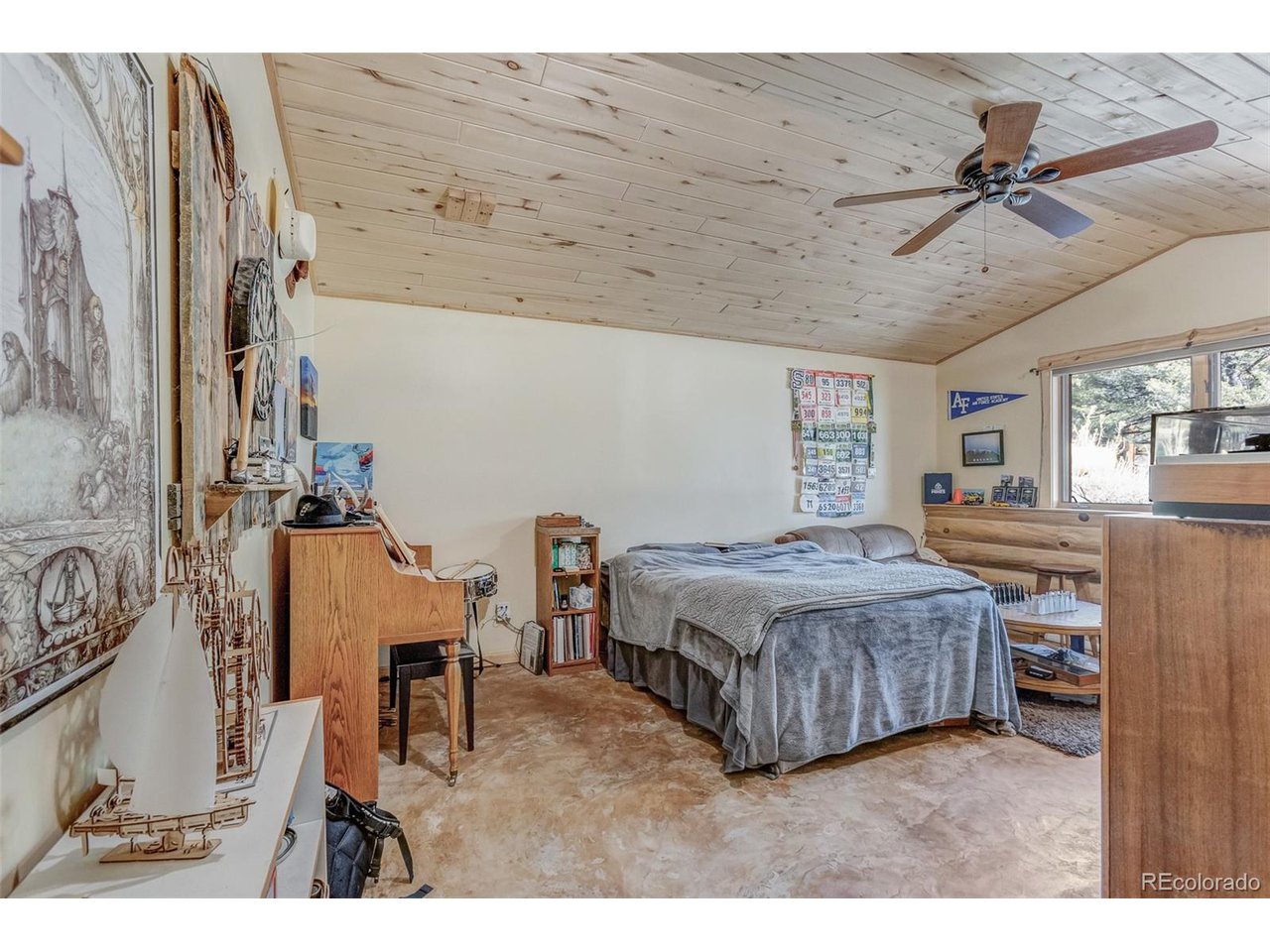 11677 Saddle Ridge Court Salida, CO 81201 - Photo 43 of 45 a living room with a bed furniture and a chandelier