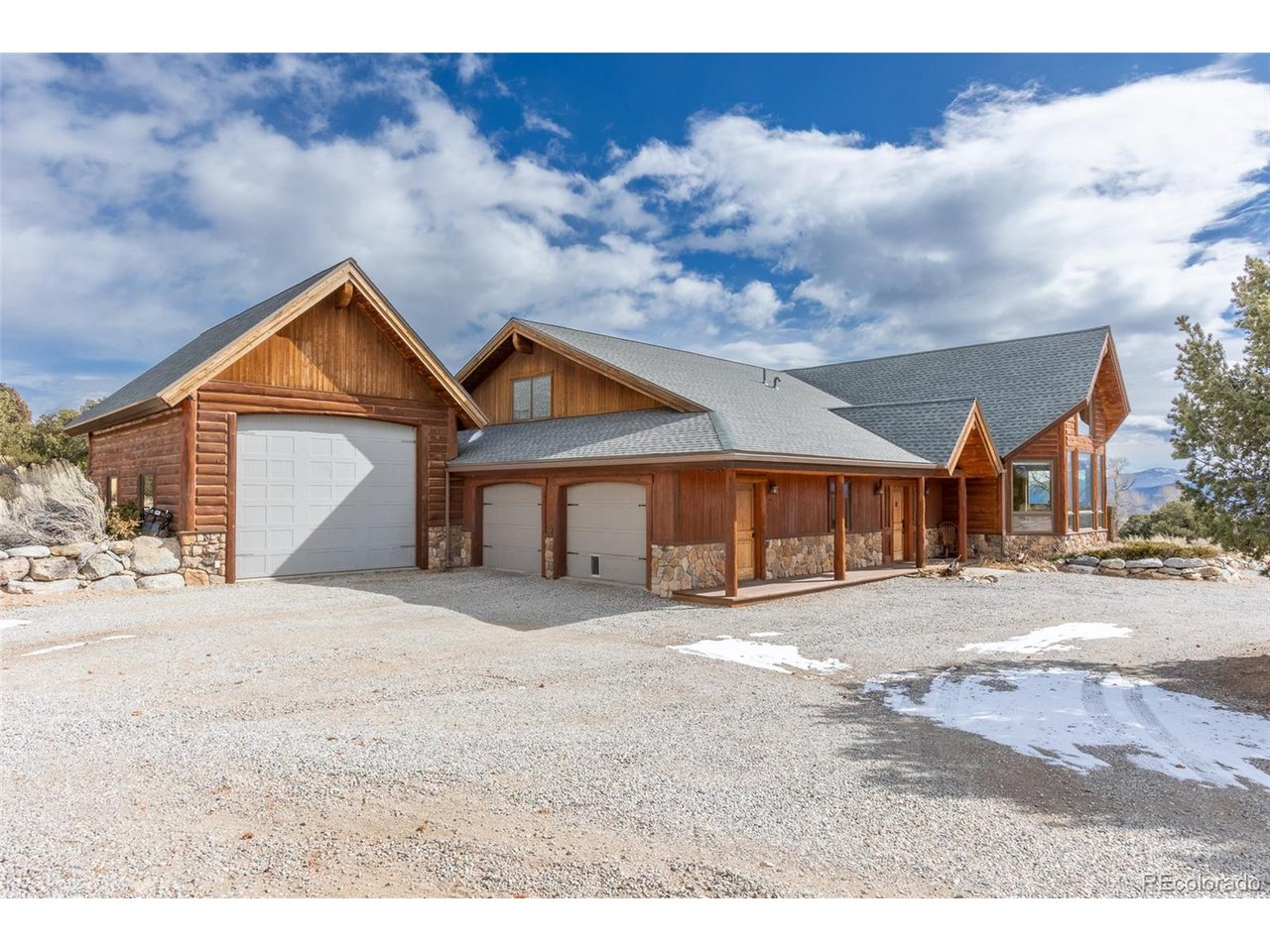 11677 Saddle Ridge Court Salida, CO 81201 - Photo 9 of 45 a front view of a house with a yard and garage