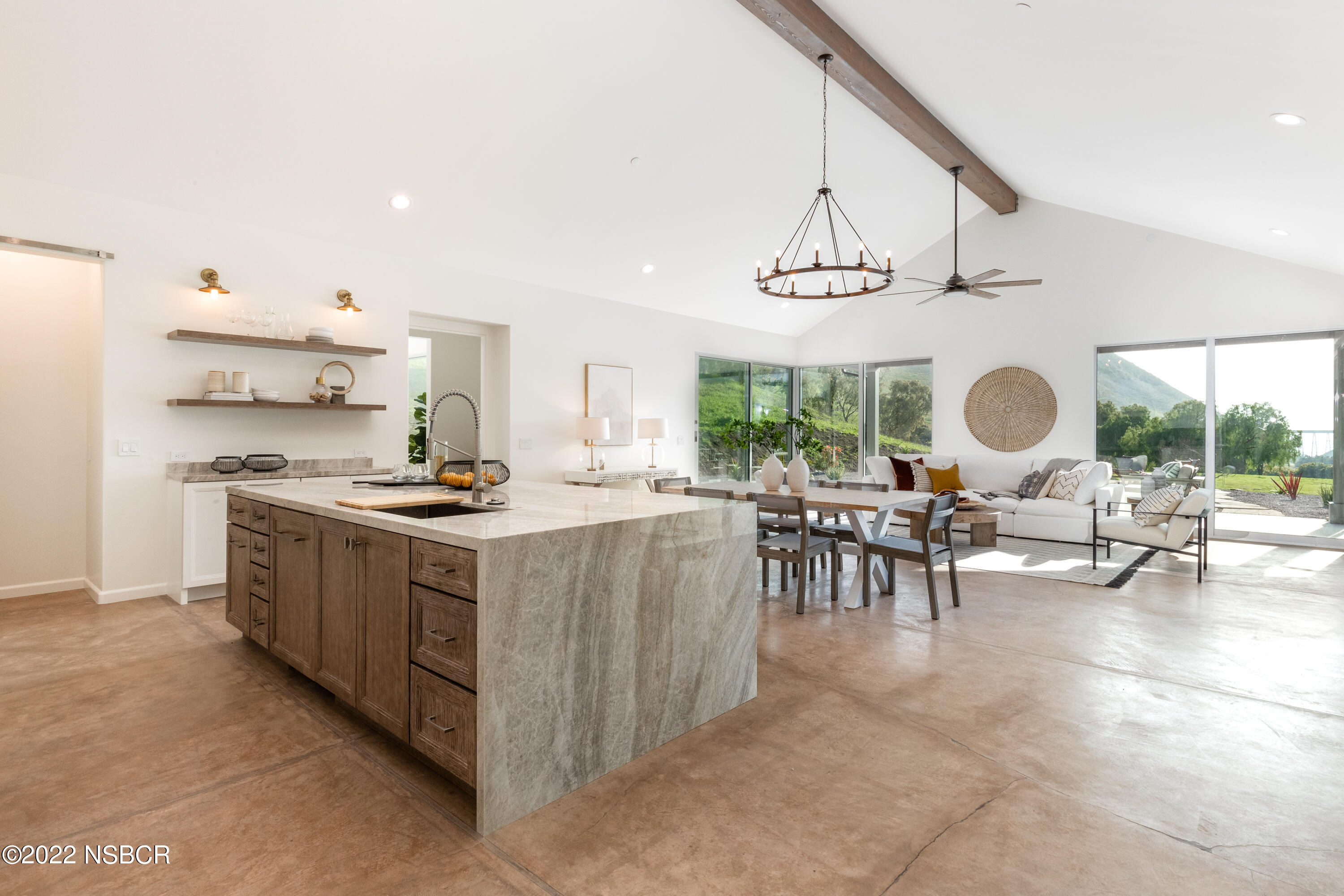 119 Hollister Ranch Road Goleta, CA 93117 - Photo 4 of 41 a kitchen with stainless steel appliances a stove a sink and a dining table