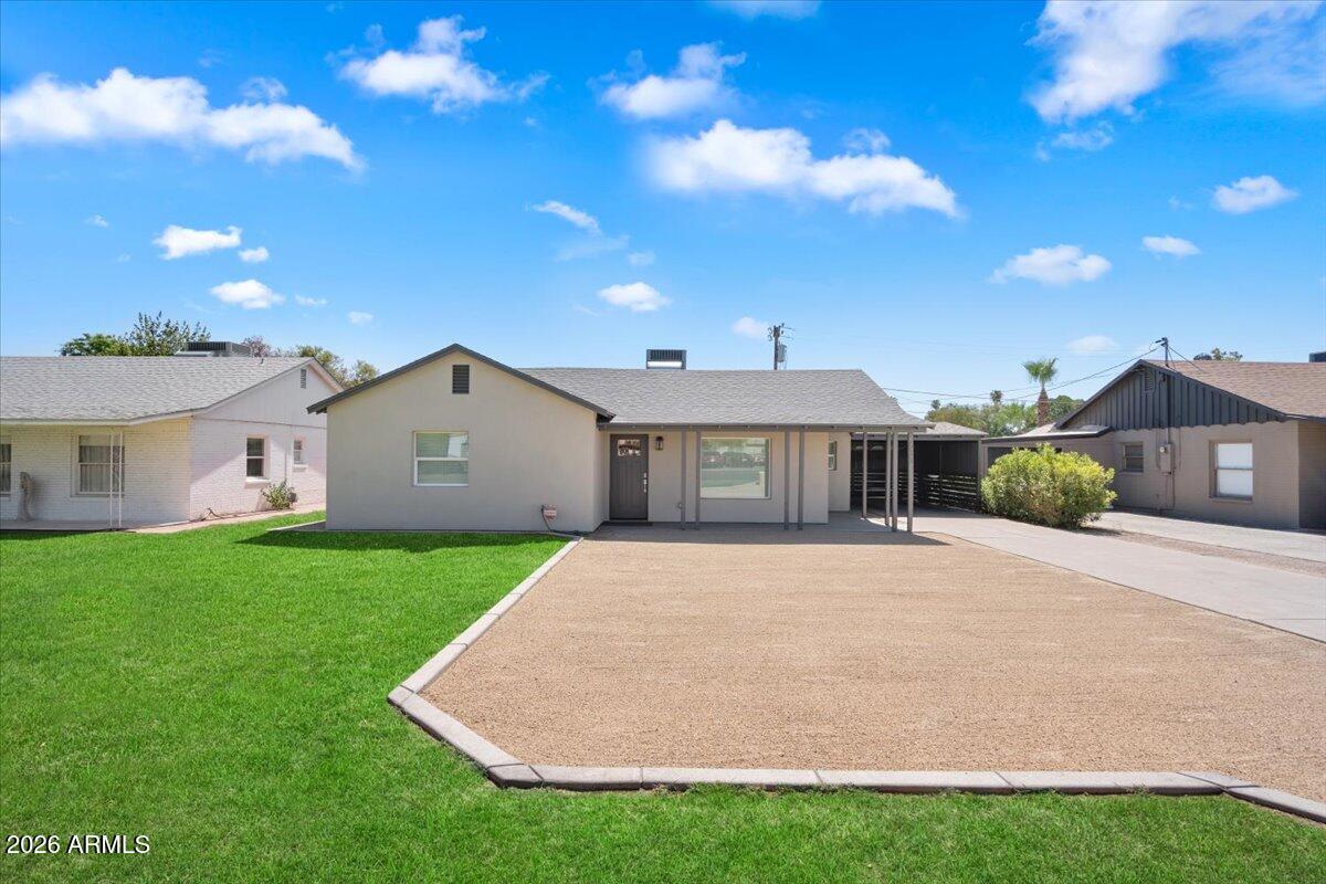 Undisclosed Address Phoenix, AZ 85013 - Photo 1 of 16 a front view of a house with garden