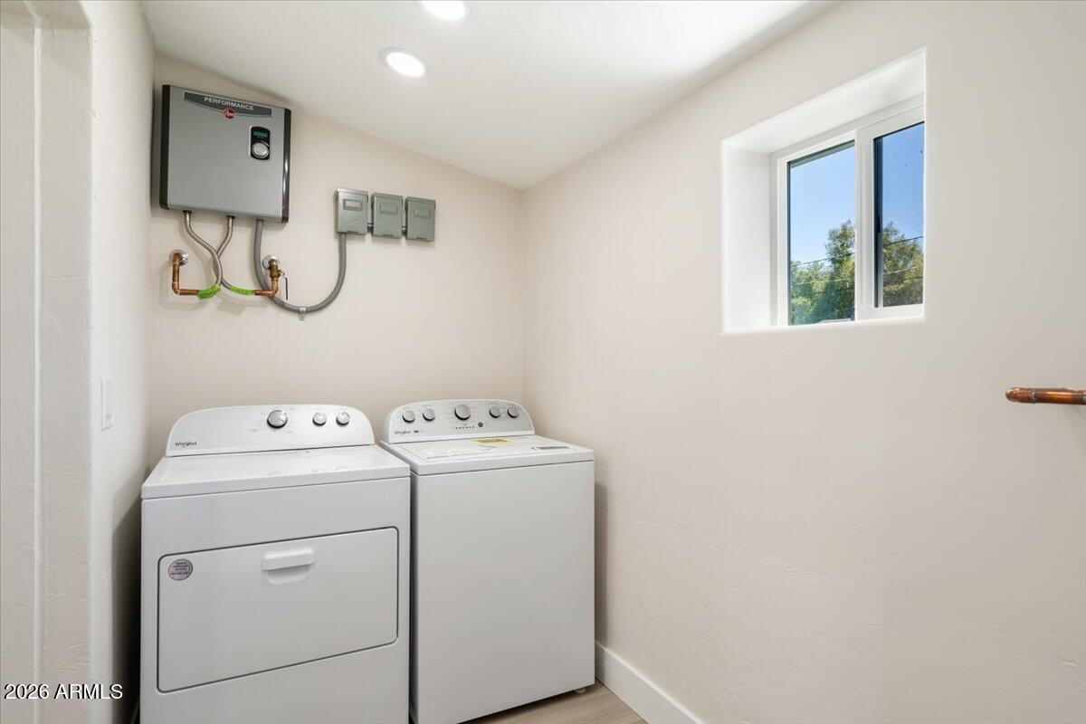 Undisclosed Address Phoenix, AZ 85013 - Photo 11 of 16 a utility room with dryer and washer
