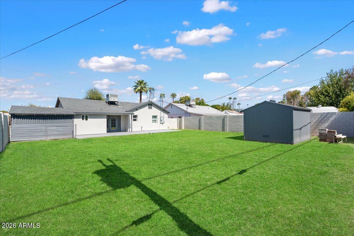 Undisclosed Address Phoenix, AZ 85013 - Photo 16 of 16 a view of a house with backyard and a garden