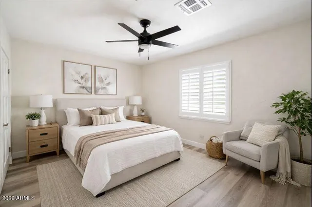 a bedroom with a bed and furniture