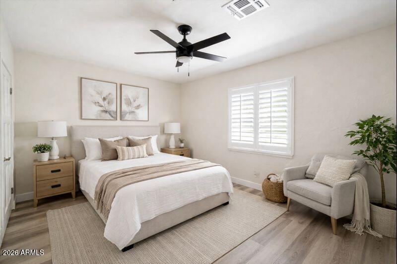 Undisclosed Address Phoenix, AZ 85013 - Photo 7 of 16 a bedroom with a bed and furniture