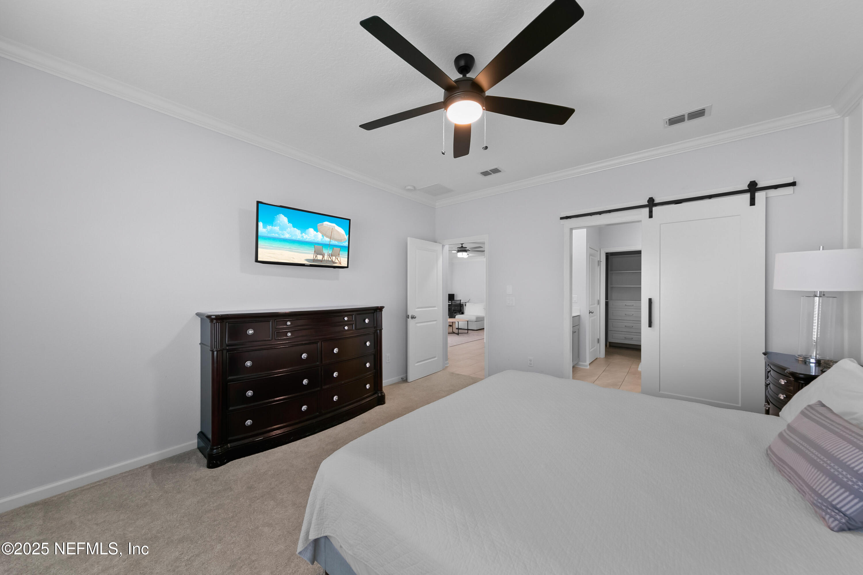 247 Beale Avenue St. Augustine, FL 32092 - Photo 14 of 62 a bedroom with a bed and a ceiling fan