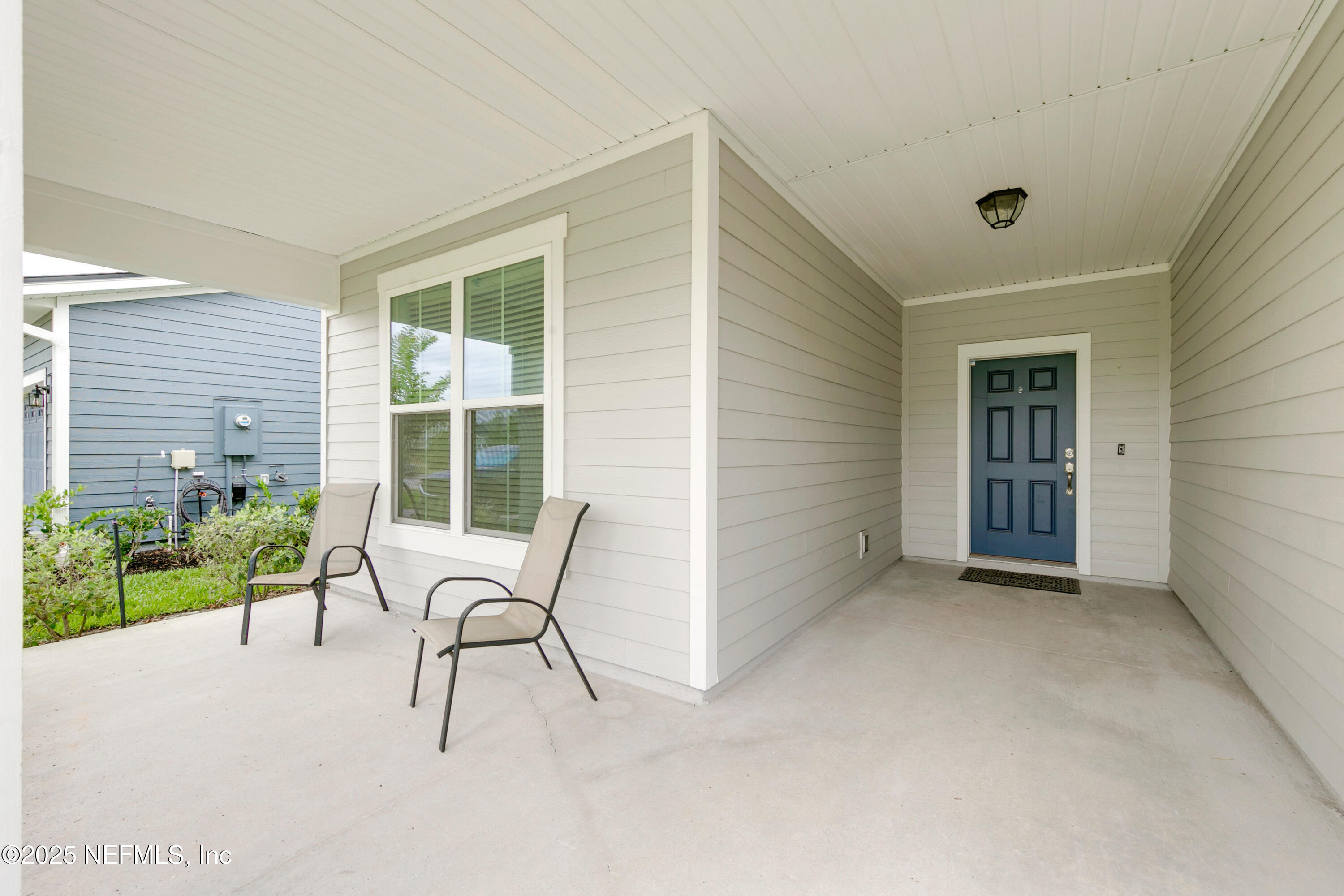 247 Beale Avenue St. Augustine, FL 32092 - Photo 2 of 62 a view of an empty room with a fireplace and a window