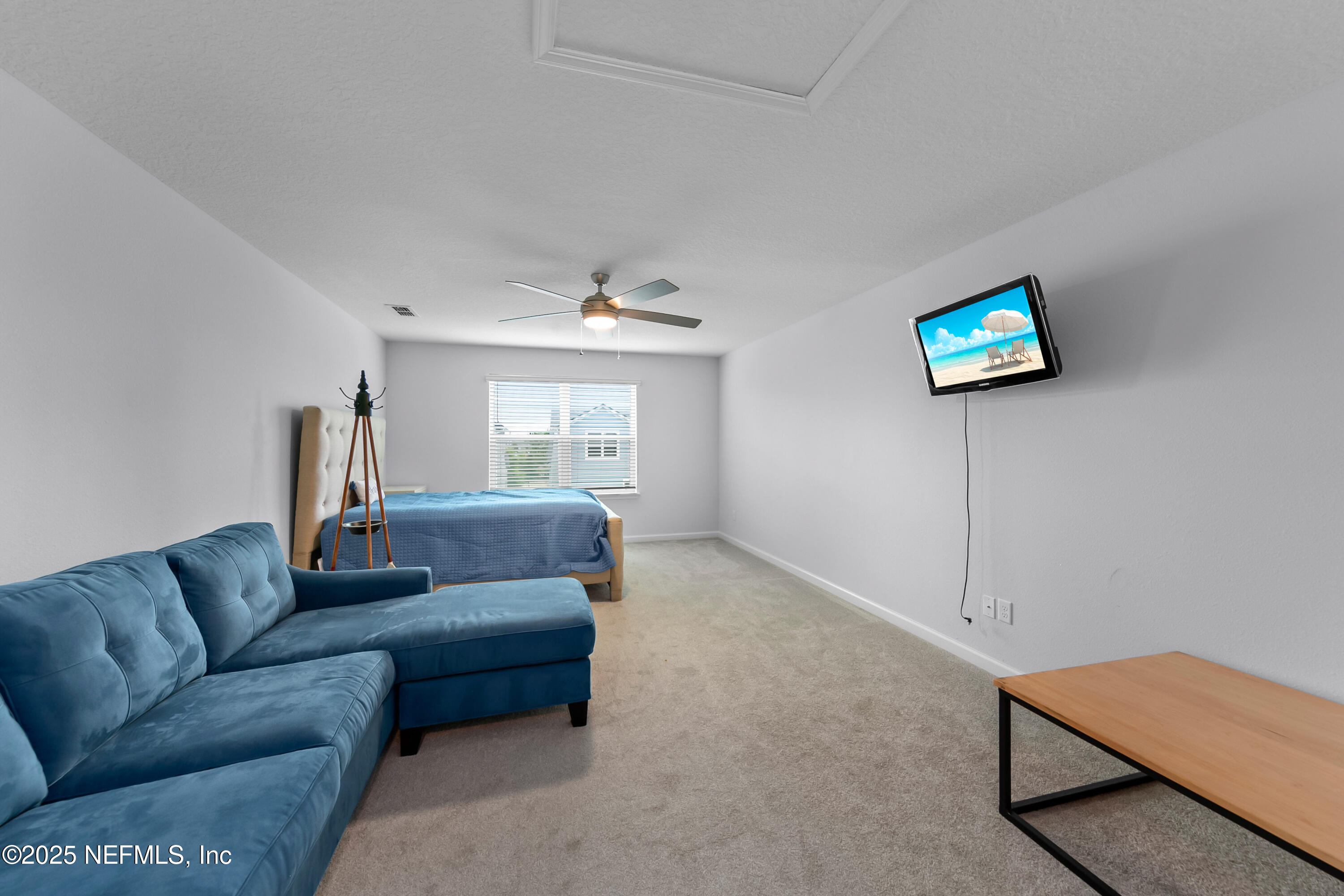 247 Beale Avenue St. Augustine, FL 32092 - Photo 22 of 62 a living room with furniture a rug and a window