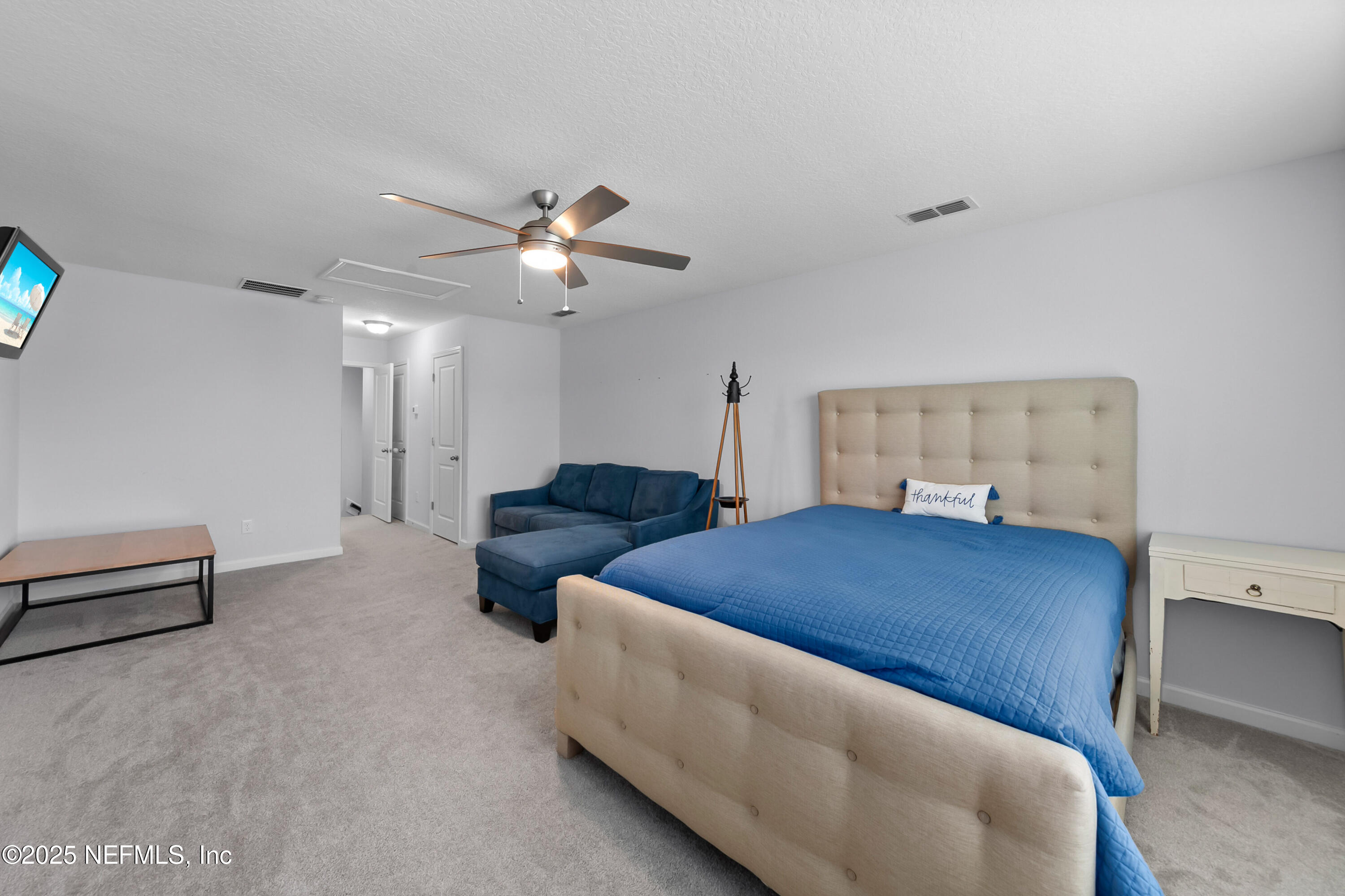 247 Beale Avenue St. Augustine, FL 32092 - Photo 23 of 62 a bedroom with furniture and a ceiling fan