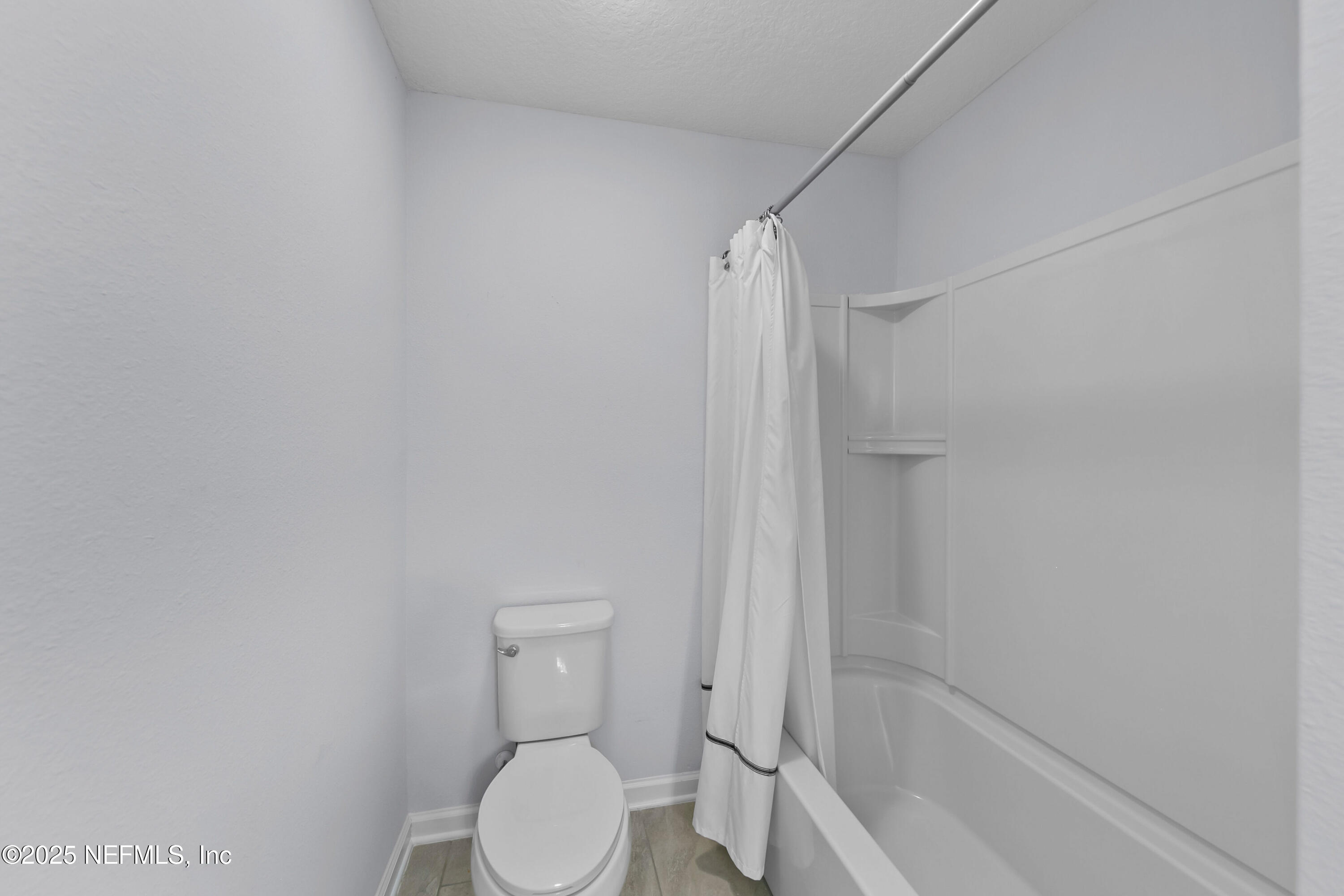 247 Beale Avenue St. Augustine, FL 32092 - Photo 24 of 62 a white toilet sitting next to a bath tub