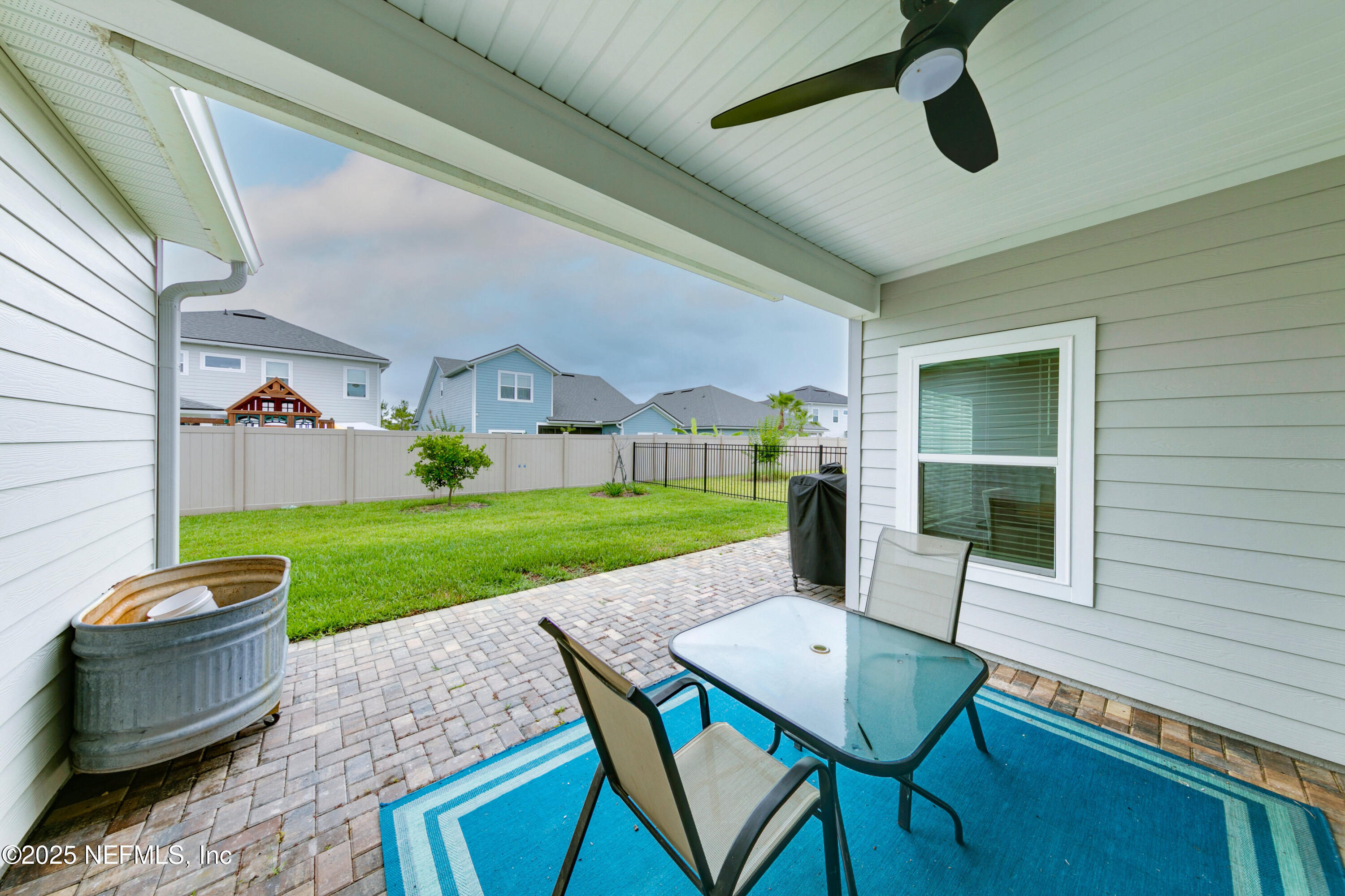 247 Beale Avenue St. Augustine, FL 32092 - Photo 27 of 62 a view of a patio with a yard