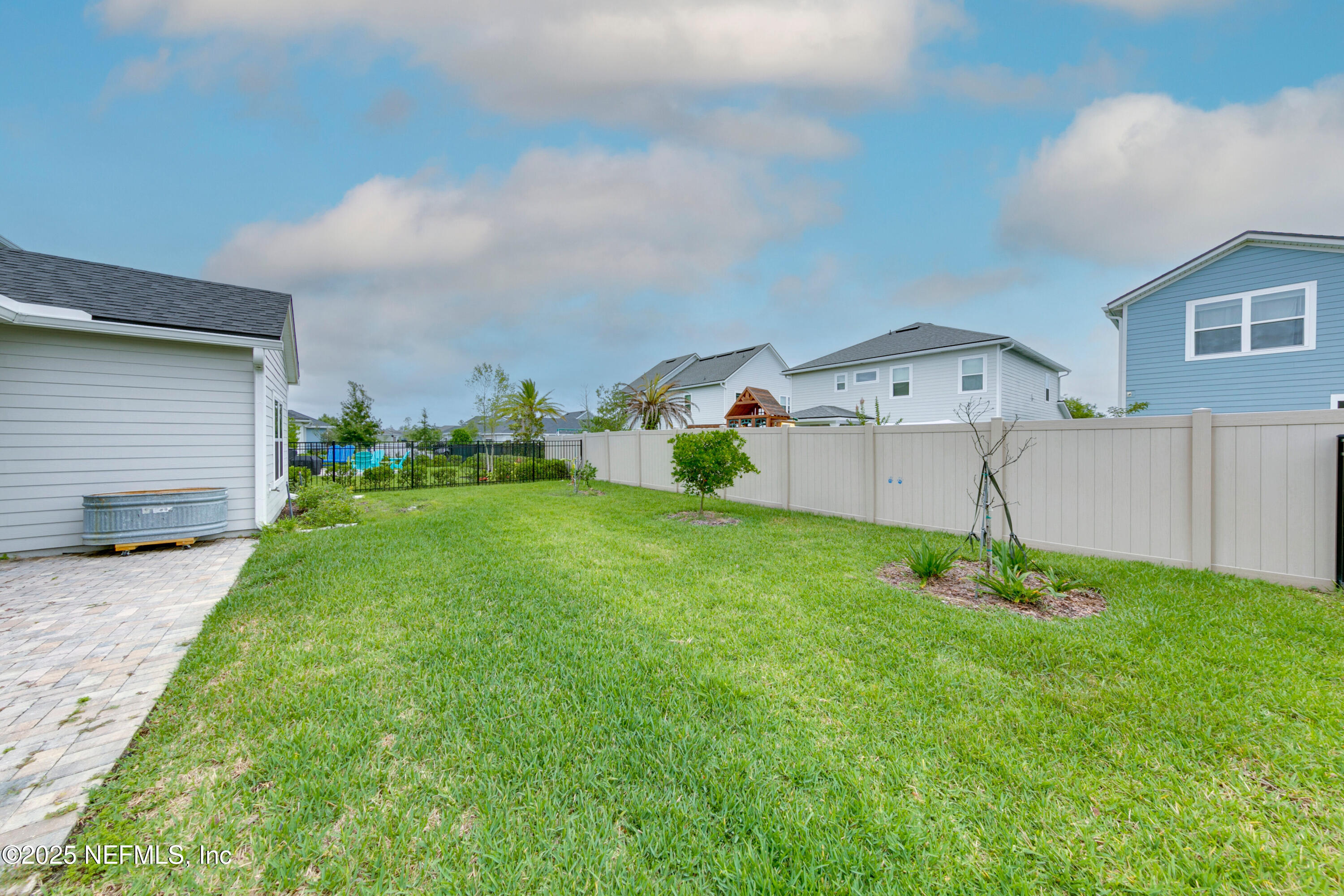 247 Beale Avenue St. Augustine, FL 32092 - Photo 29 of 62 a backyard of a house with table and chairs