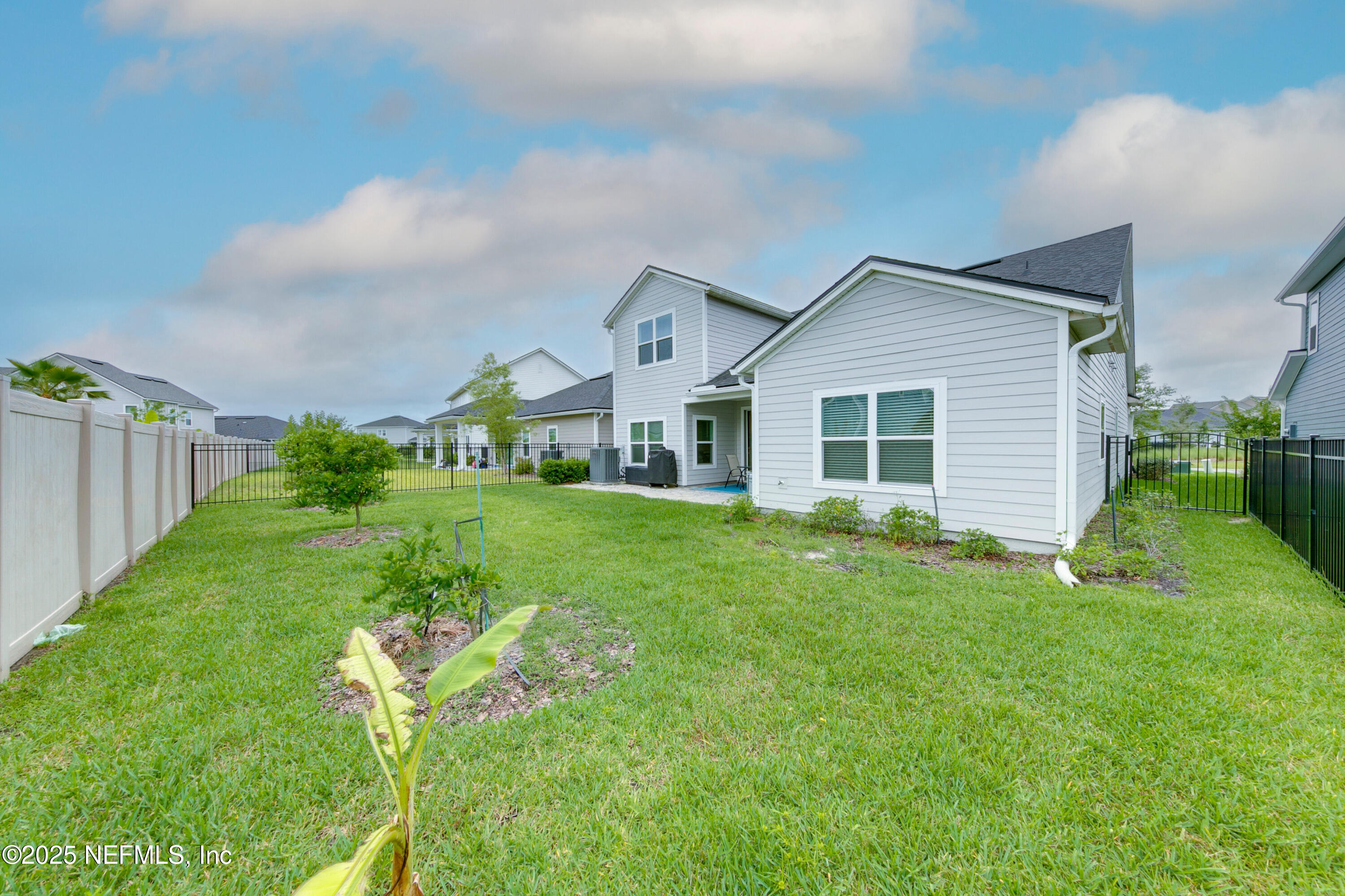 247 Beale Avenue St. Augustine, FL 32092 - Photo 30 of 62 a front view of house with yard and green space