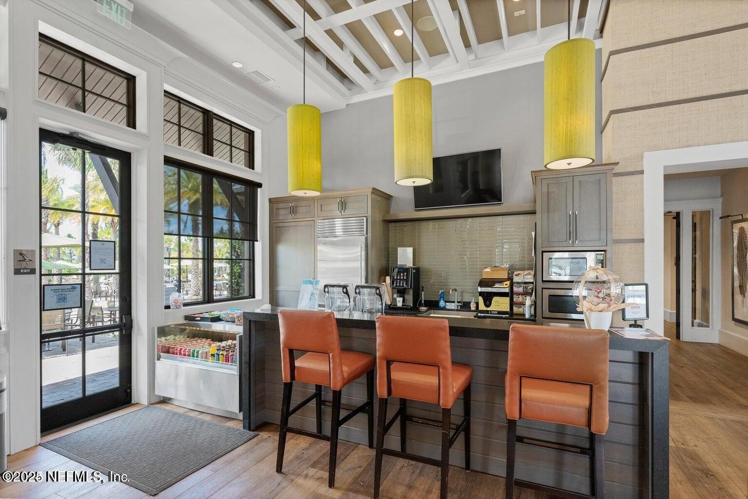 247 Beale Avenue St. Augustine, FL 32092 - Photo 48 of 62 a dining room with stainless steel appliances furniture a window and kitchen view