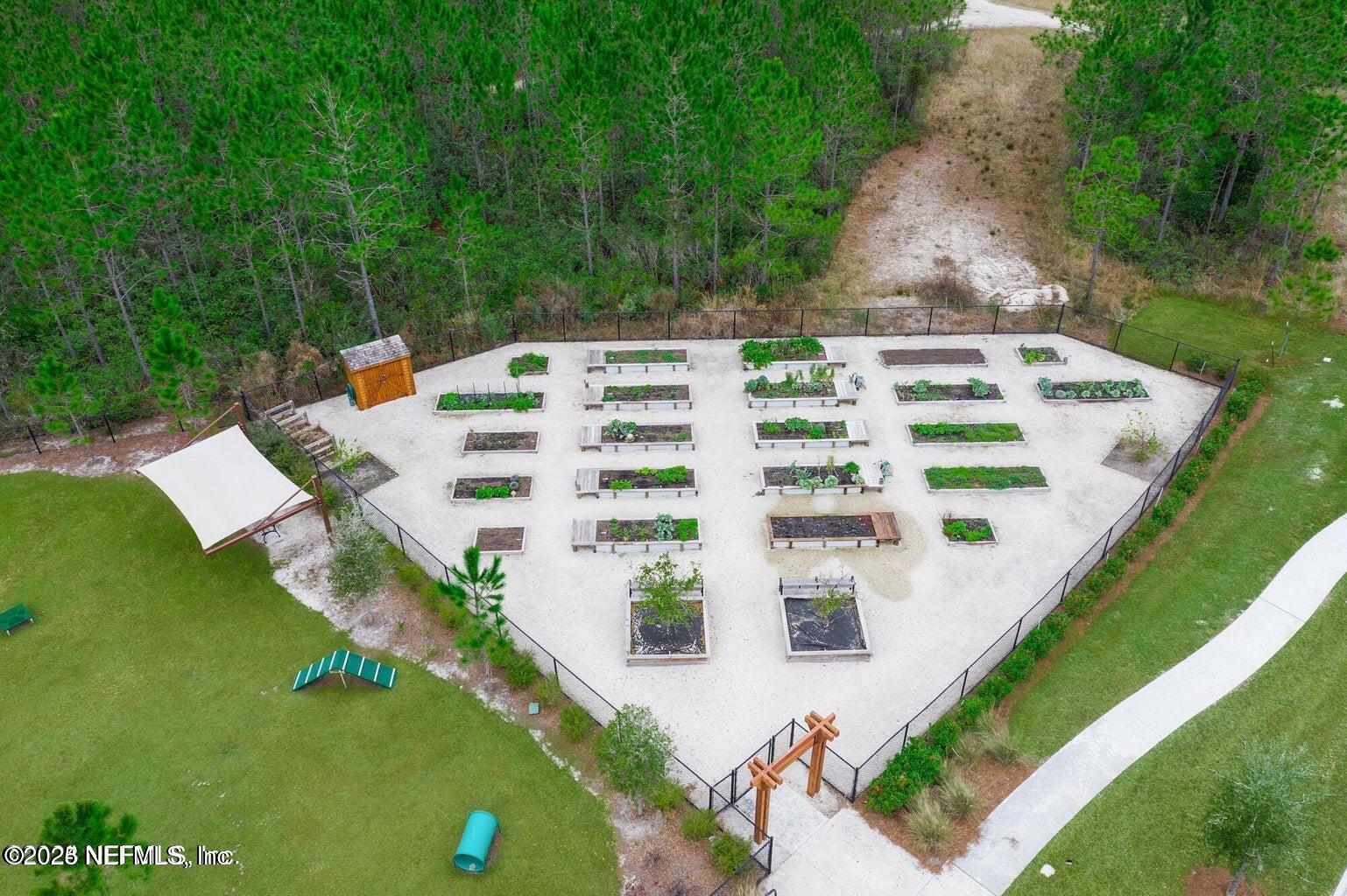 247 Beale Avenue St. Augustine, FL 32092 - Photo 52 of 62 a view of a white house with a yard