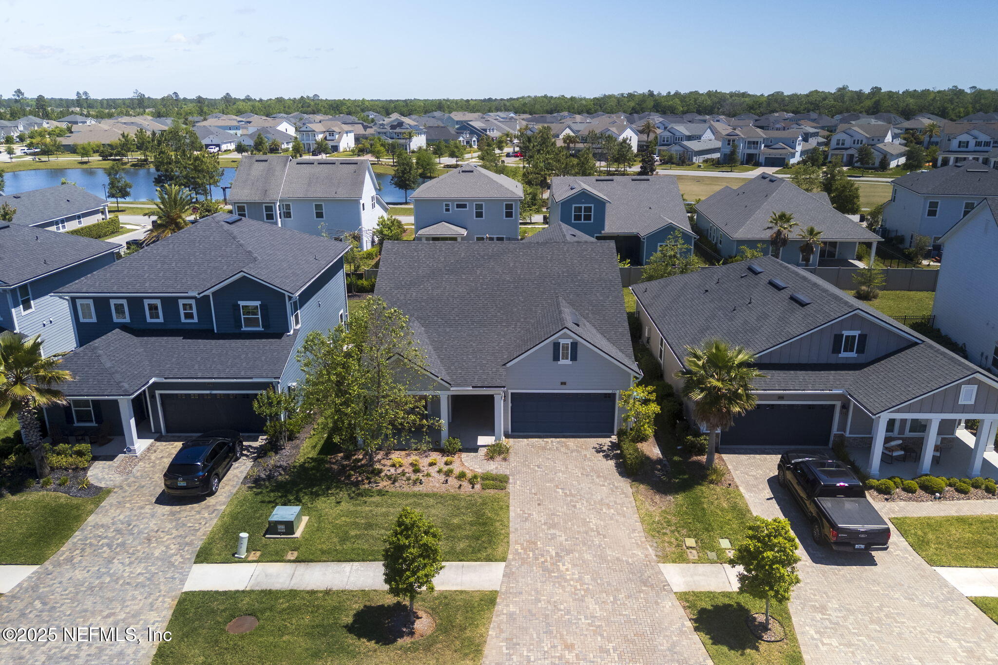 247 Beale Avenue St. Augustine, FL 32092 - Photo 58 of 62 a aerial view of a house with a yard potted plants and a large tree