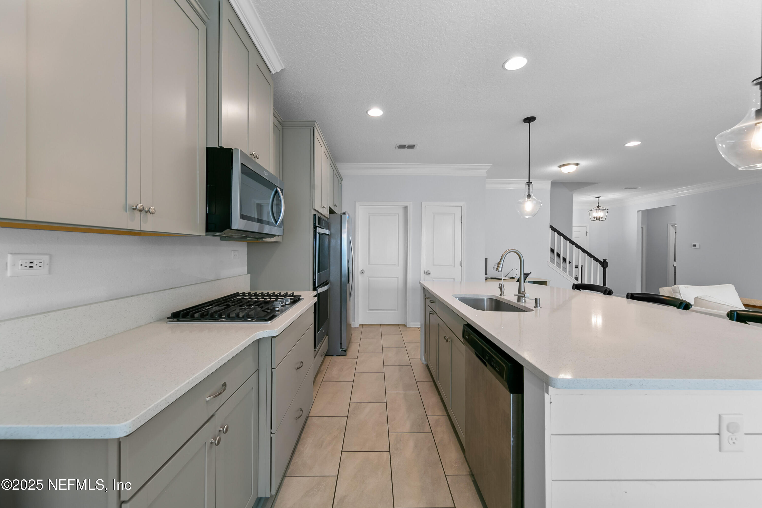 247 Beale Avenue St. Augustine, FL 32092 - Photo 9 of 62 a kitchen with stainless steel appliances granite countertop a sink a stove and a refrigerator