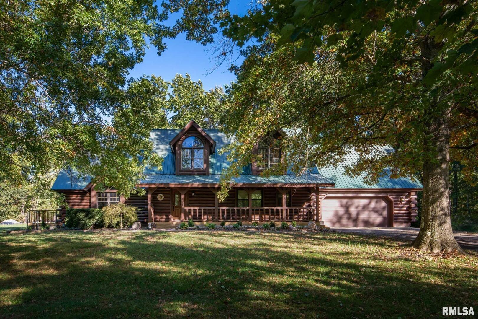 2145 Lick Creek Road Anna, IL 62906 - Photo 1 of 64 a front view of a house with a garden