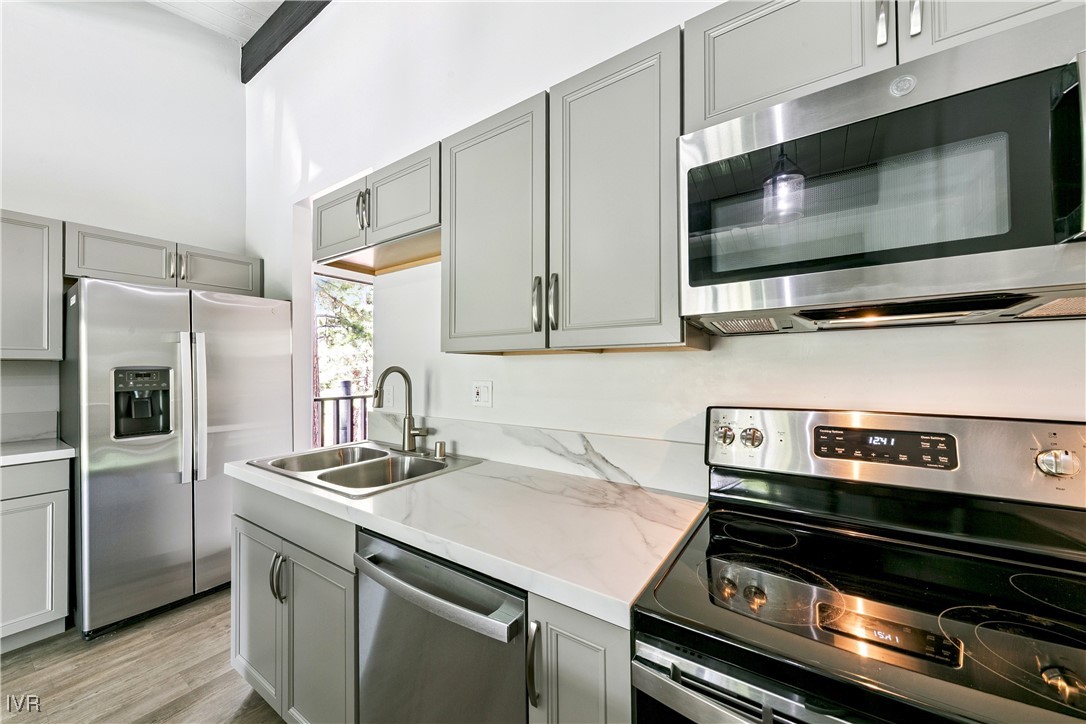 a kitchen with a stove microwave and refrigerator