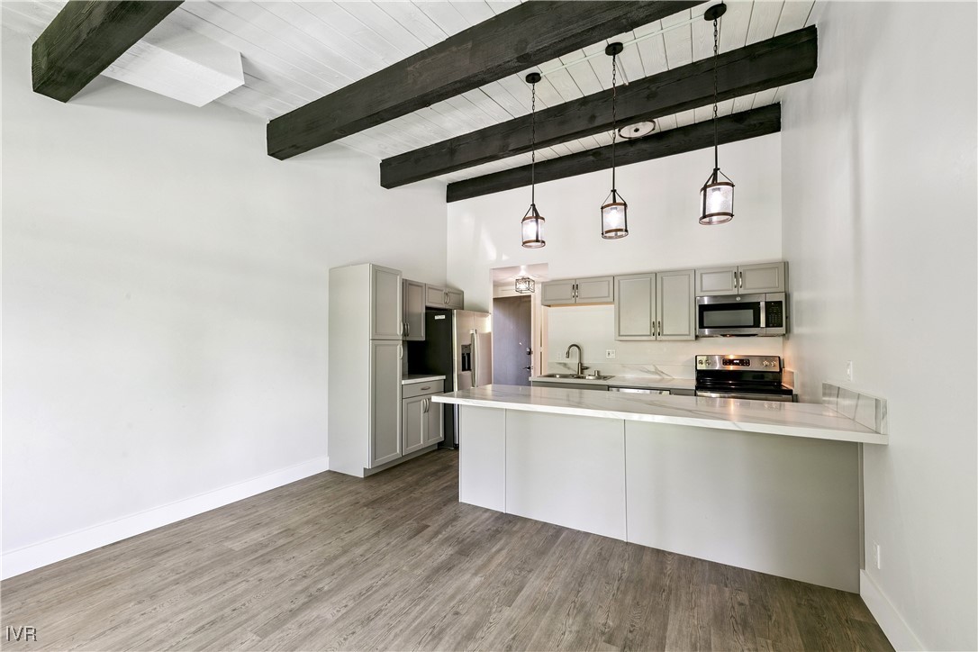 751 Tahoe Boulevard, Unit 20 Incline Village, NV 89451 - Photo 2 of 13 a kitchen with stainless steel appliances a sink and cabinets