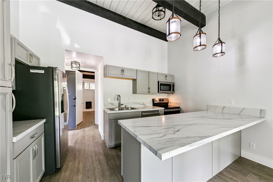 751 Tahoe Boulevard, Unit 20 Incline Village, NV 89451 - Photo 5 of 13 a kitchen with stainless steel appliances granite countertop a sink refrigerator and cabinets