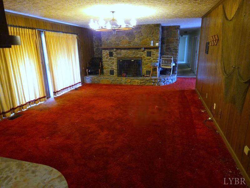 11420 Wards Road Rustburg, VA 24588 - Photo 12 of 34 a view of an empty room with a fireplace