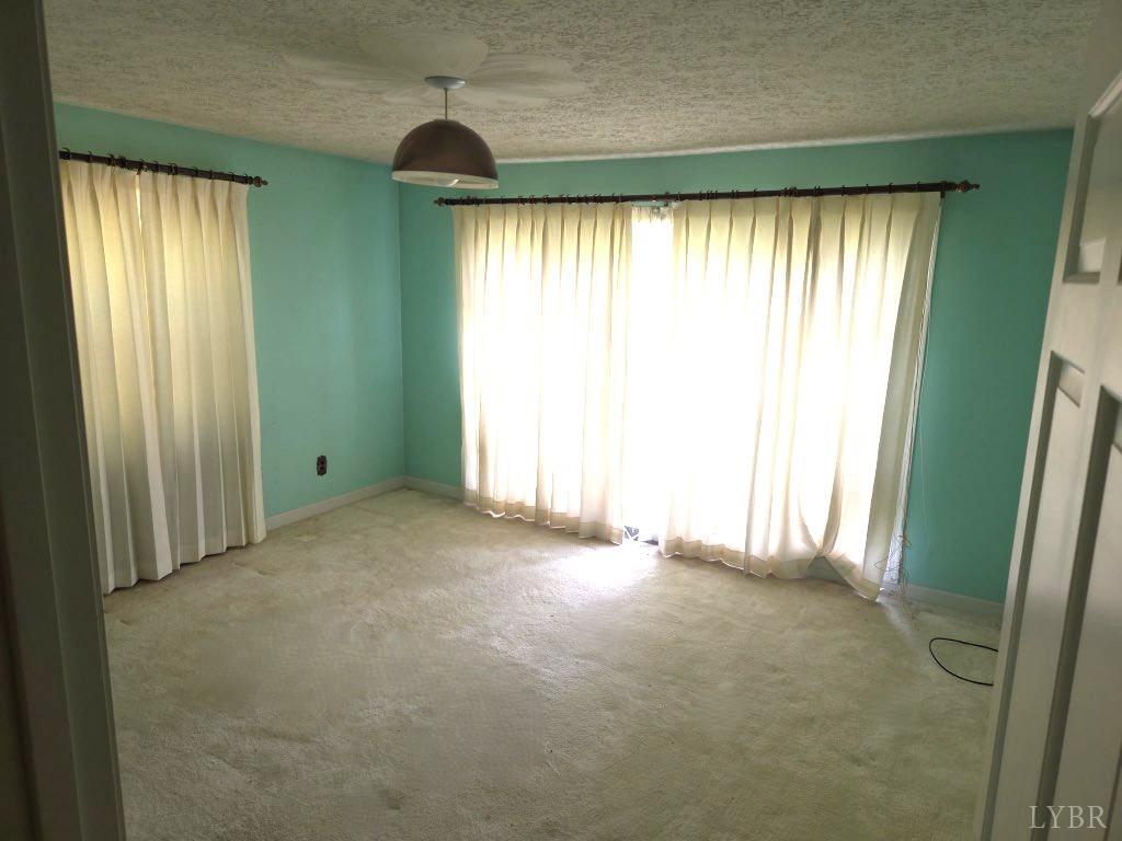 11420 Wards Road Rustburg, VA 24588 - Photo 15 of 34 an empty room with window and an outdoor view