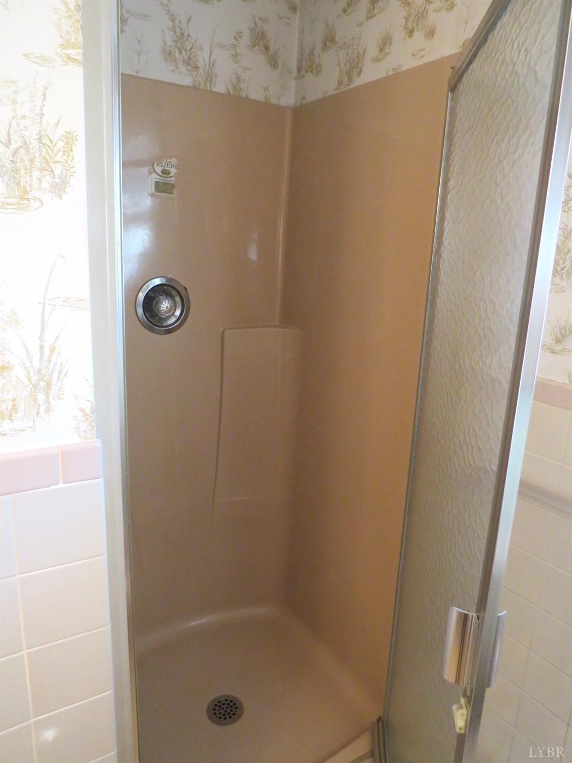 11420 Wards Road Rustburg, VA 24588 - Photo 22 of 34 a bathroom with a shower