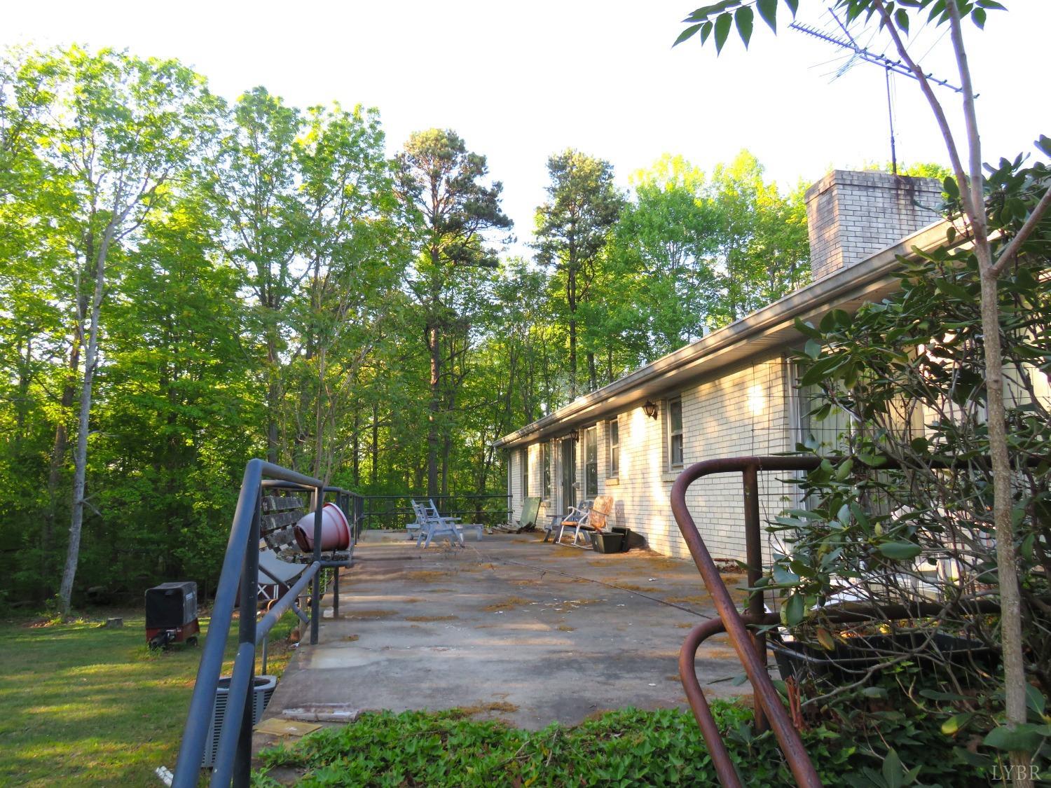 11420 Wards Road Rustburg, VA 24588 - Photo 24 of 34 a view of a chair and table in the backyard