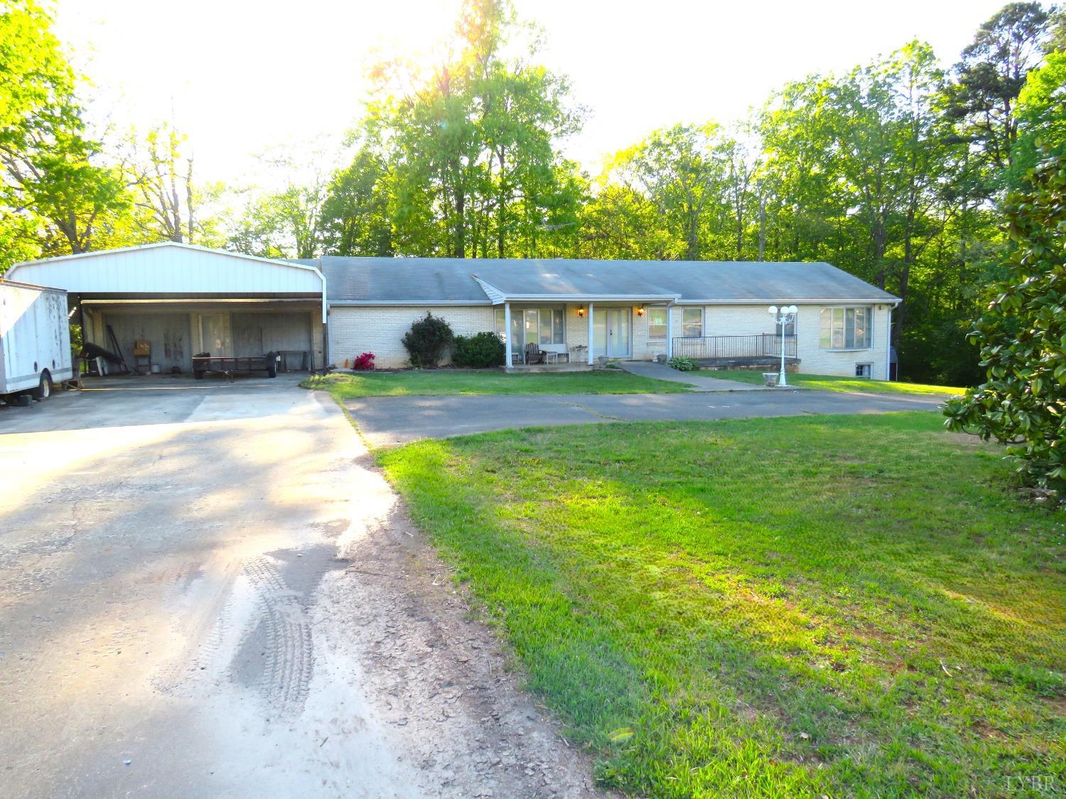 11420 Wards Road Rustburg, VA 24588 - Photo 3 of 34 a view of a house with a yard and a garden