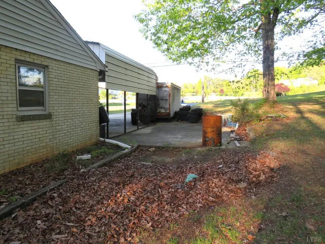 a view of a backyard with large trees