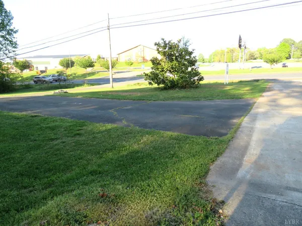 a view of a yard with a lake view