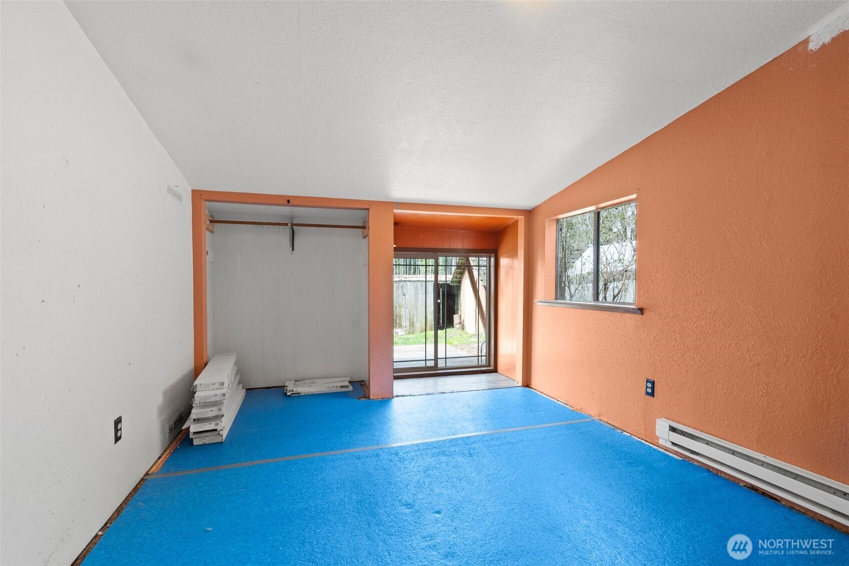 288 Hewitt Road Chehalis, WA 98532 - Photo 12 of 40 an empty room with wooden floor and windows