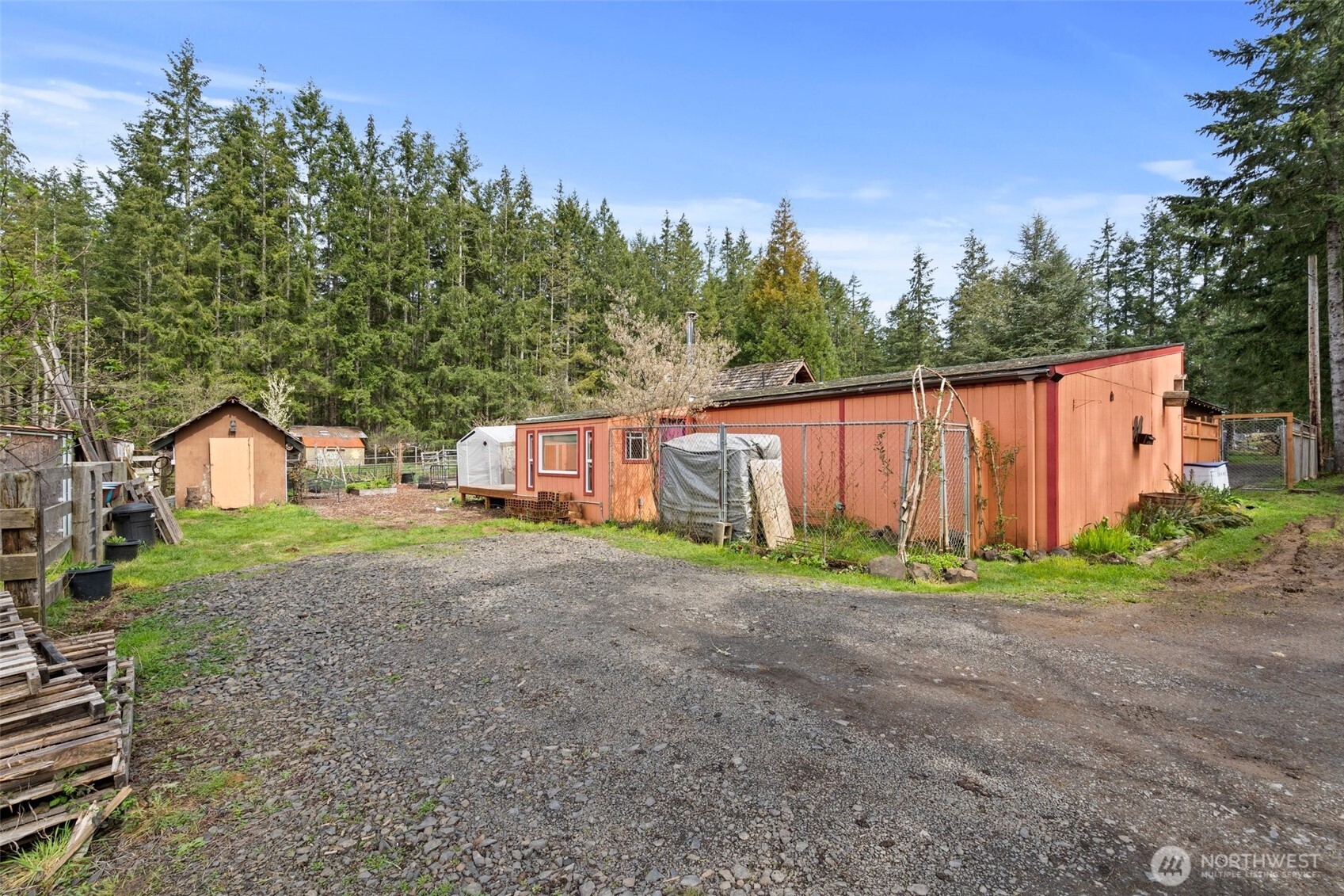 288 Hewitt Road Chehalis, WA 98532 - Photo 17 of 40 a view of a house with backyard and trees