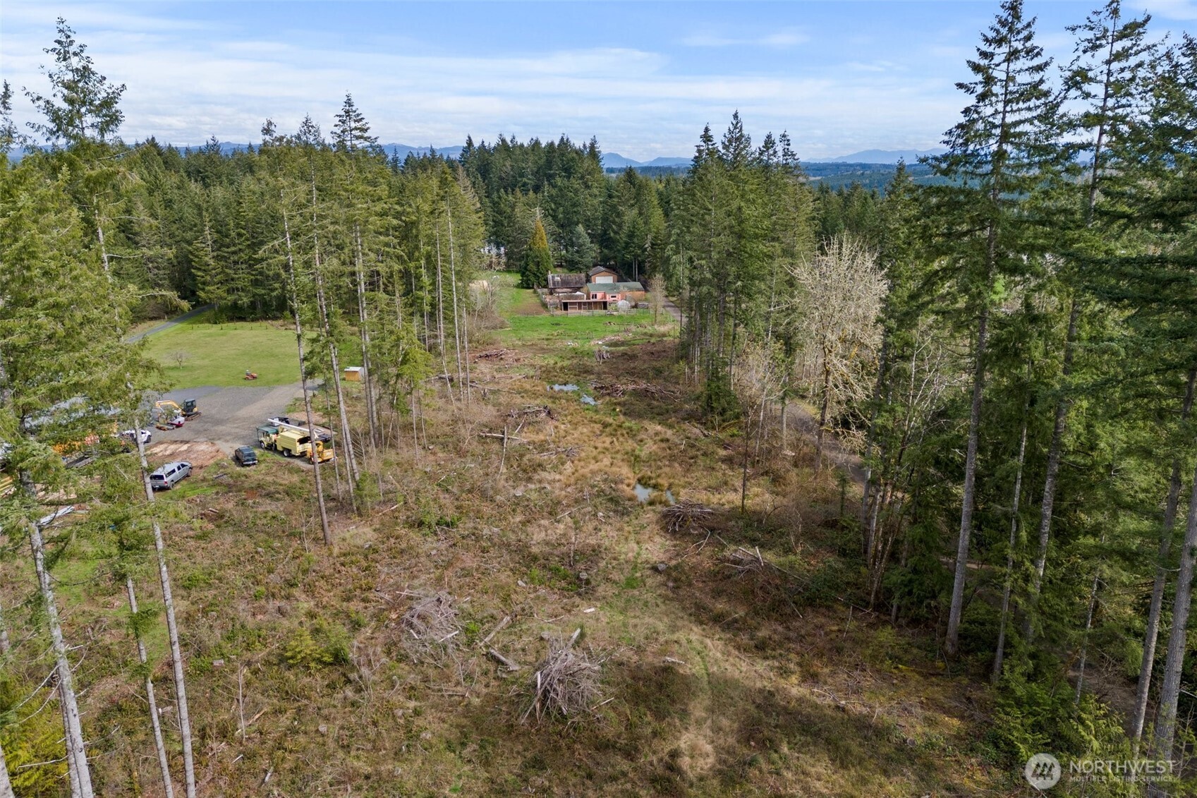 288 Hewitt Road Chehalis, WA 98532 - Photo 6 of 40 a view of a lake with houses in back
